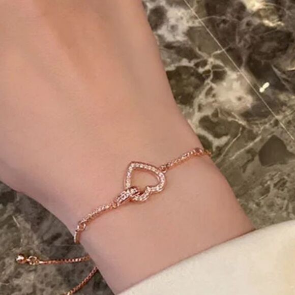 The Rose Gold Heart Chakra Slide Closure bracelet with heart pendant. - Picture 8 of 9